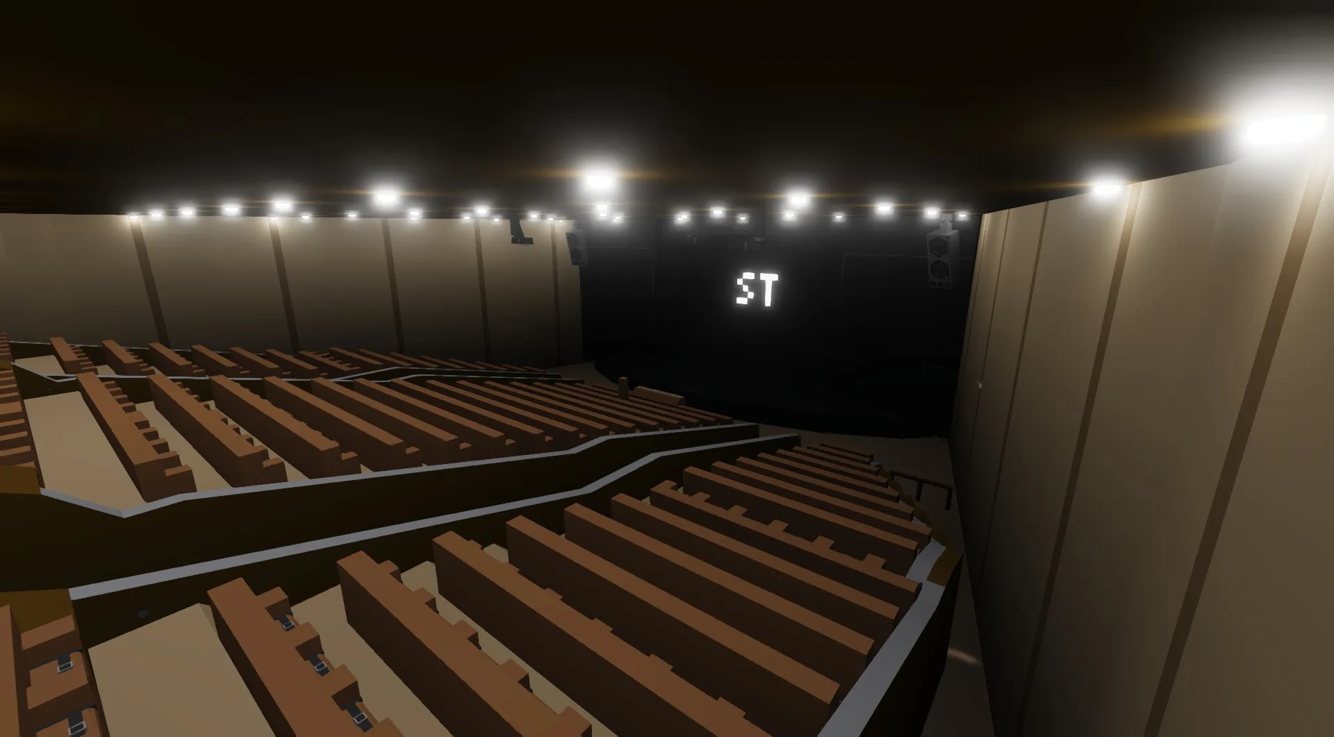 The SentyTek Theater auditorium, with a stage, a large screen, and rows of seats.